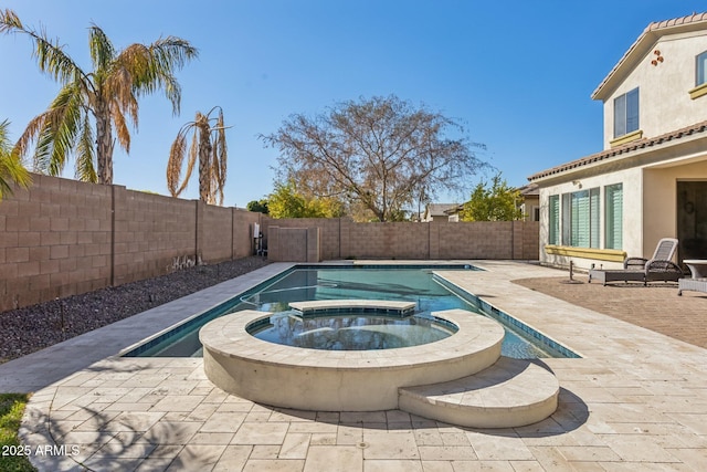 view of swimming pool featuring a patio and an in ground hot tub