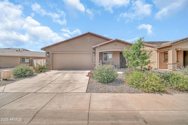 25787 W Allen St, Buckeye, AZ 85326 - mediterranean / spanish-style house with stucco siding, driveway, a garage, cooling unit, and a tiled roof