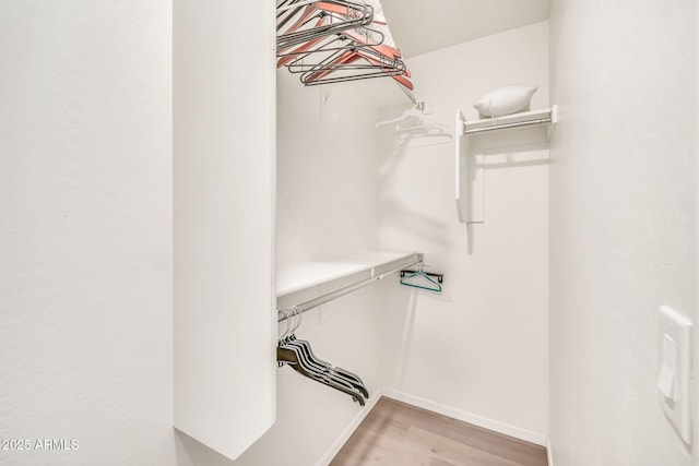25787 W Allen St, Buckeye, AZ 85326 - spacious closet featuring wood finished floors