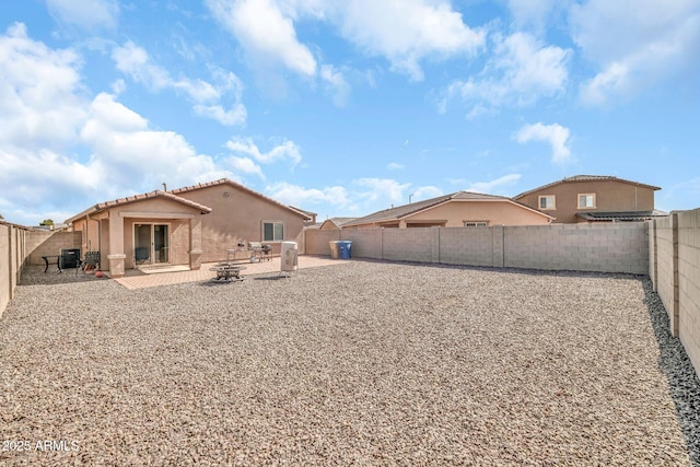25787 W Allen St, Buckeye, AZ 85326 - rear view of house with stucco siding, a fenced backyard, a patio area, and a tile roof