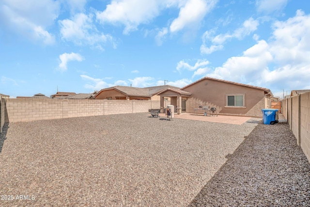 25787 W Allen St, Buckeye, AZ 85326 - rear view of house featuring a patio area, stucco siding, a fenced backyard, and a tile roof