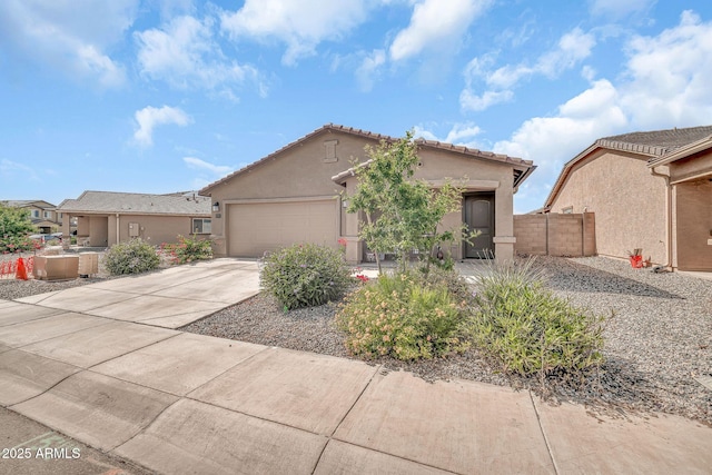 25787 W Allen St, Buckeye, AZ 85326 - view of front of home featuring stucco siding, a garage, concrete driveway, and a tiled roof