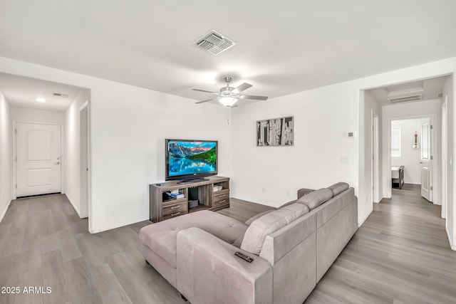 25787 W Allen St, Buckeye, AZ 85326 - living area with light wood-style flooring, ceiling fan, and baseboards