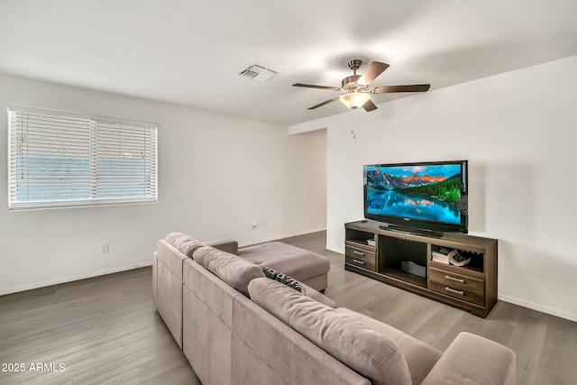 25787 W Allen St, Buckeye, AZ 85326 - living room with a ceiling fan, wood finished floors, and baseboards