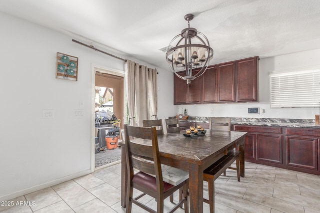 12128 W Range Mule Dr, Peoria, AZ 85383 - dining space featuring a chandelier, light tile patterned flooring, and baseboards