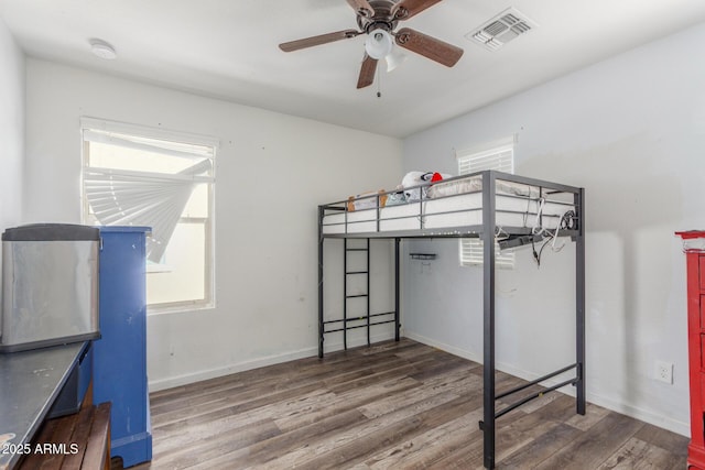 12128 W Range Mule Dr, Peoria, AZ 85383 - unfurnished bedroom with wood finished floors and baseboards