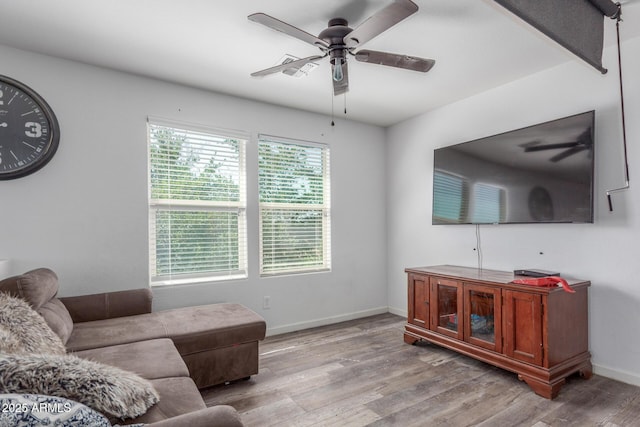 12128 W Range Mule Dr, Peoria, AZ 85383 - living room featuring a ceiling fan, wood finished floors, and baseboards