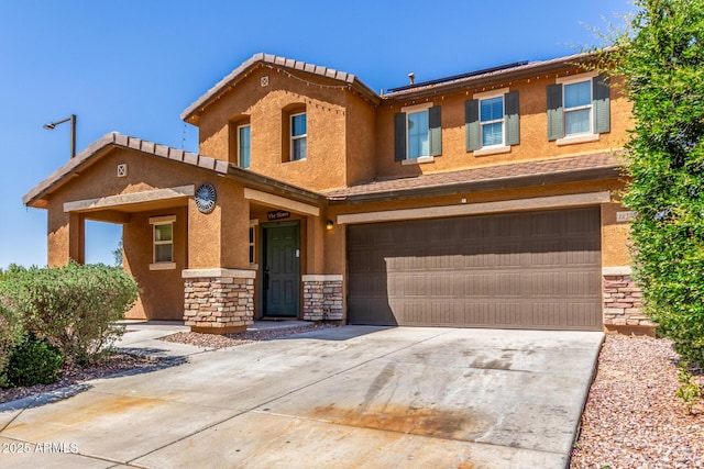 12128 W Range Mule Dr, Peoria, AZ 85383 - view of property featuring stone siding, a garage, driveway, and stucco siding