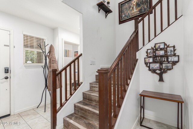 12128 W Range Mule Dr, Peoria, AZ 85383 - stairway featuring baseboards and tile patterned floors