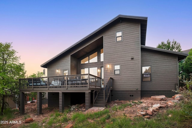 6564 W Spirit Trl, Pine, AZ 85544 - back of property at dusk featuring a wooden deck and stairs