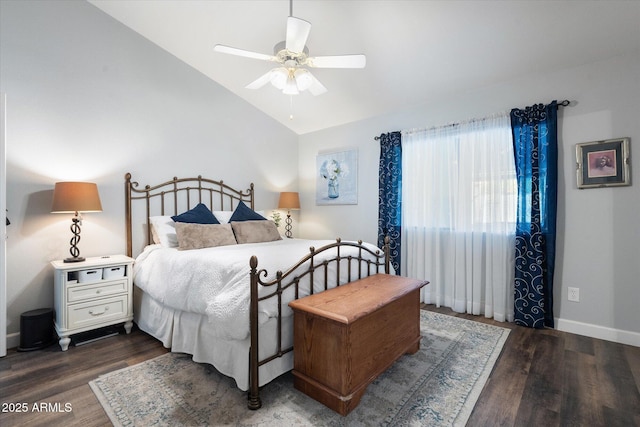 bedroom with ceiling fan, wood finished floors, baseboards, and vaulted ceiling