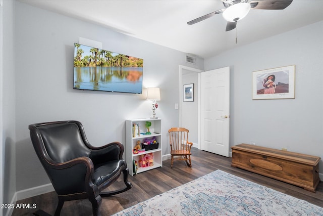 sitting room with visible vents, ceiling fan, baseboards, and wood finished floors