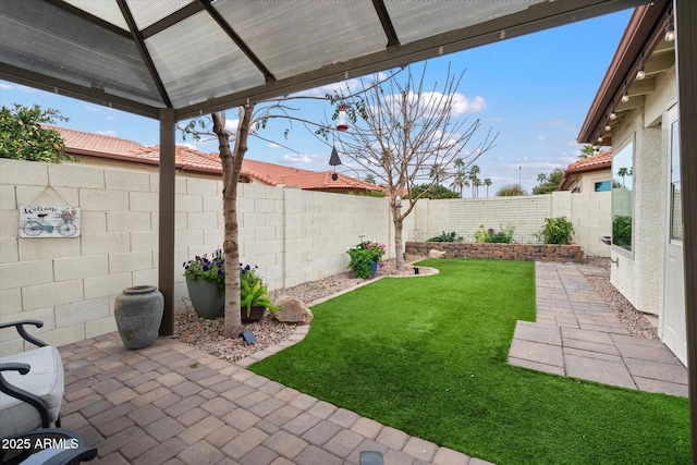 view of yard featuring a patio area and a fenced backyard