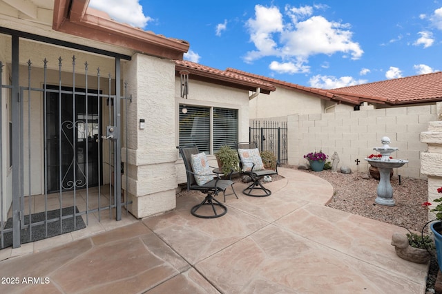 view of patio featuring fence