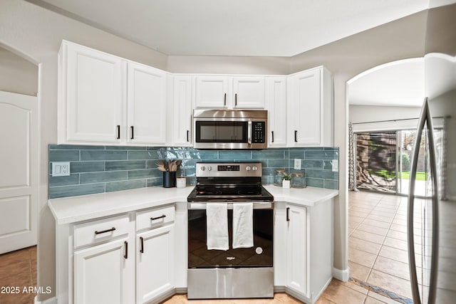 16424 S 46th Way, Phoenix, AZ 85048 - kitchen featuring appliances with stainless steel finishes, arched walkways, and light countertops