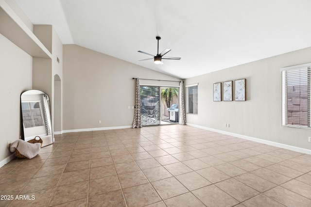 16424 S 46th Way, Phoenix, AZ 85048 - unfurnished living room with ceiling fan, light tile patterned floors, lofted ceiling, baseboards, and a heating unit