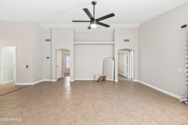 16424 S 46th Way, Phoenix, AZ 85048 - unfurnished living room with arched walkways, high vaulted ceiling, ceiling fan, light tile patterned floors, and baseboards