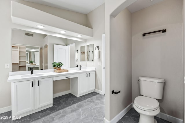 16424 S 46th Way, Phoenix, AZ 85048 - bathroom with double vanity, toilet, baseboards, tile patterned flooring, and recessed lighting