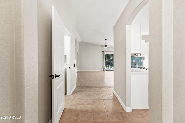 16424 S 46th Way, Phoenix, AZ 85048 - corridor featuring arched walkways, light tile patterned floors, and baseboards
