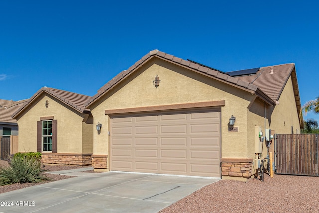 ranch-style home with a garage