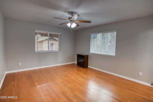 281 S 31st Dr, Show Low, AZ 85901 - spare room featuring ceiling fan, wood finished floors, healthy amount of natural light, and baseboards