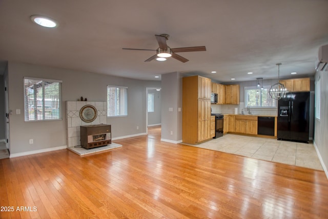 281 S 31st Dr, Show Low, AZ 85901 - unfurnished living room featuring a ceiling fan, a chandelier, light wood-type flooring, baseboards, and recessed lighting