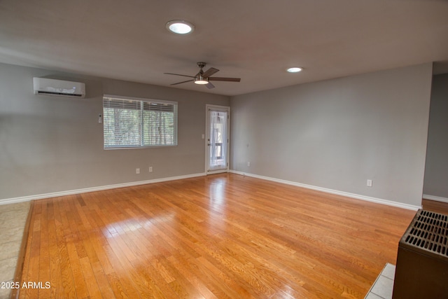 281 S 31st Dr, Show Low, AZ 85901 - spare room featuring a wall unit AC, ceiling fan, light wood-style flooring, baseboards, and recessed lighting