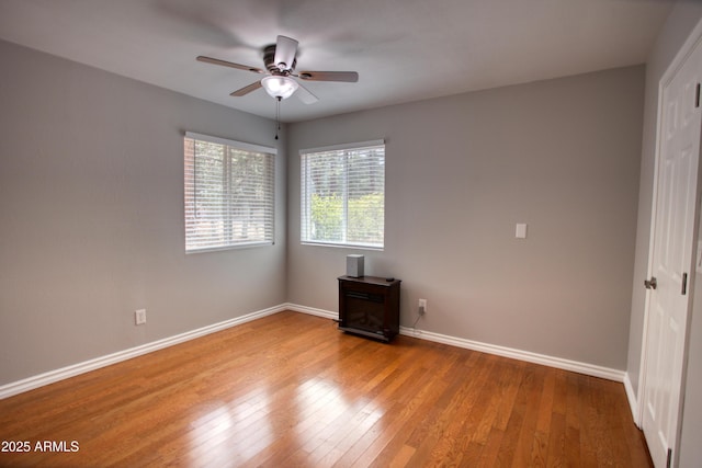 281 S 31st Dr, Show Low, AZ 85901 - spare room featuring a ceiling fan, hardwood / wood-style flooring, and baseboards