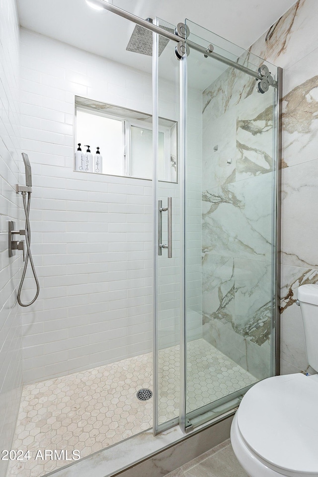 2942 N 81st Pl, Scottsdale, AZ 85251 - bathroom featuring a shower with door and toilet
