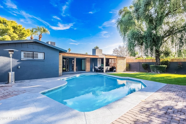 2942 N 81st Pl, Scottsdale, AZ 85251 - view of swimming pool with a patio and a lawn