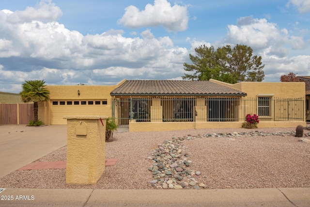 7252 E Edgewood Ave, Mesa, AZ 85208 - southwest-style home with fence, driveway, stucco siding, and a garage