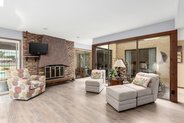 7252 E Edgewood Ave, Mesa, AZ 85208 - living area featuring a brick fireplace and wood finished floors