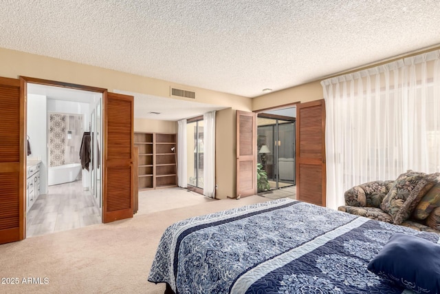 7252 E Edgewood Ave, Mesa, AZ 85208 - bedroom with light carpet, visible vents, and a textured ceiling