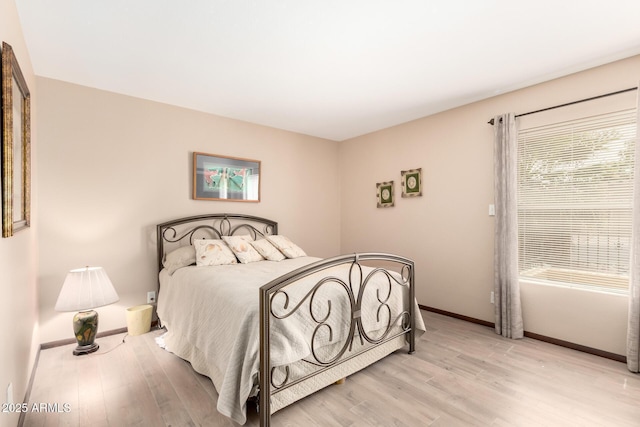 7252 E Edgewood Ave, Mesa, AZ 85208 - bedroom with baseboards, multiple windows, and light wood-type flooring