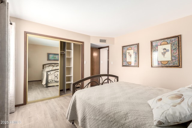 7252 E Edgewood Ave, Mesa, AZ 85208 - bedroom with a closet, visible vents, and light wood-style floors