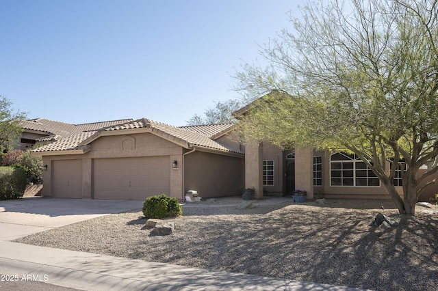 18873 N 94th Way, Scottsdale, AZ 85255 - view of front facade with a garage, a tiled roof, stucco siding, and concrete driveway