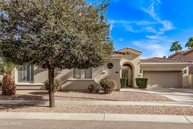 4667 E Reins Rd, Gilbert, AZ 85297 - view of front facade featuring an attached garage, stucco siding, and driveway