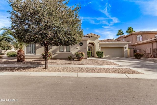 4667 E Reins Rd, Gilbert, AZ 85297 - view of front facade featuring an attached garage, driveway, stucco siding, and a tile roof