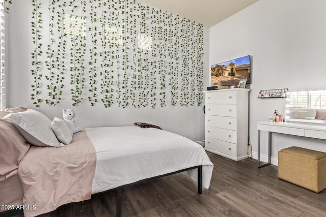4667 E Reins Rd, Gilbert, AZ 85297 - bedroom with wood finished floors, baseboards, and lofted ceiling