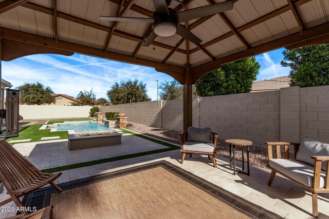 4667 E Reins Rd, Gilbert, AZ 85297 - fenced backyard featuring a patio area, a ceiling fan, and a gazebo