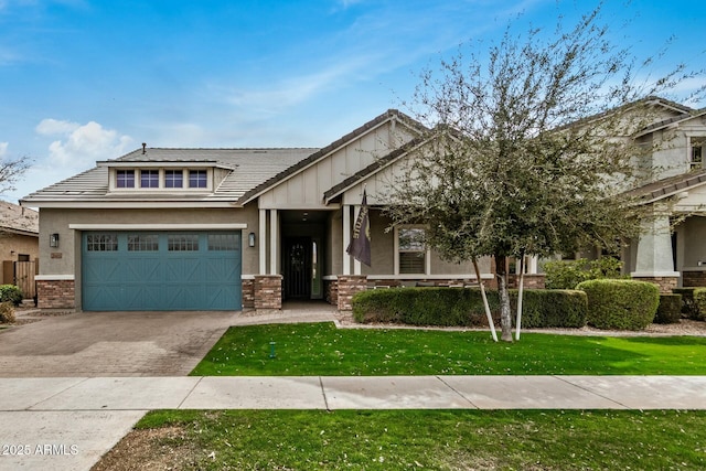 craftsman-style home featuring a front yard and a garage