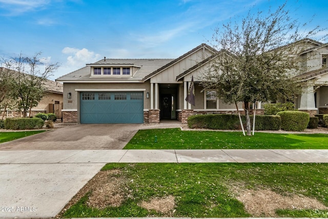 view of front of home featuring a front yard and a garage