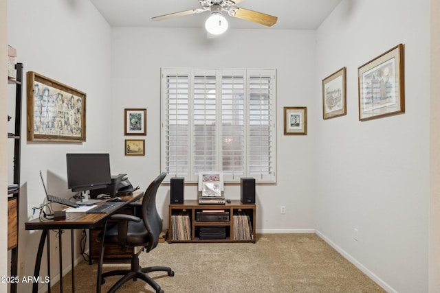 carpeted home office with ceiling fan