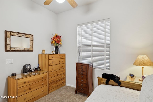 bedroom with light colored carpet and ceiling fan