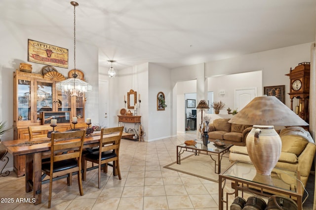 dining area with light tile patterned floors and a notable chandelier