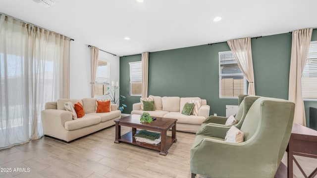 3117 E Hayfield Way, San Tan Valley, AZ 85140 - living room featuring recessed lighting and light wood finished floors