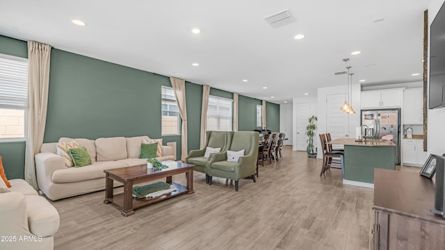 3117 E Hayfield Way, San Tan Valley, AZ 85140 - living room featuring light wood-style floors and recessed lighting