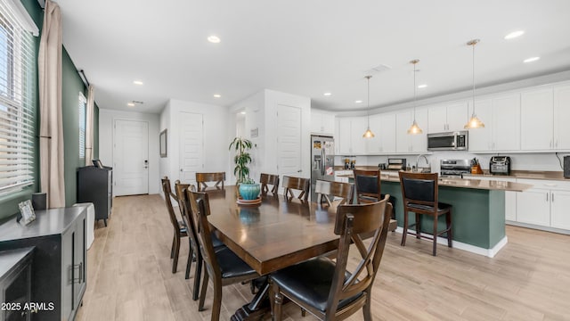 3117 E Hayfield Way, San Tan Valley, AZ 85140 - dining space featuring light wood-type flooring and recessed lighting