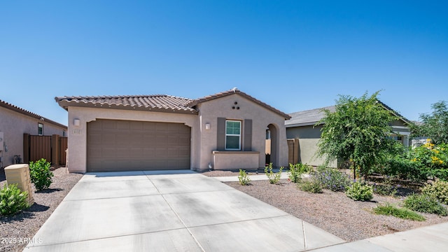 3117 E Hayfield Way, San Tan Valley, AZ 85140 - mediterranean / spanish home featuring an attached garage, stucco siding, driveway, and fence