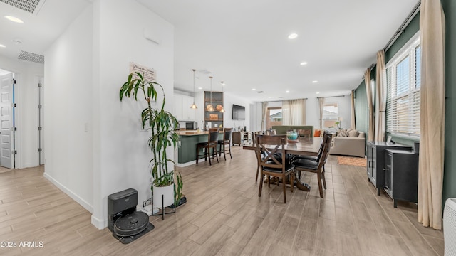 3117 E Hayfield Way, San Tan Valley, AZ 85140 - dining room with light wood finished floors, recessed lighting, and baseboards
